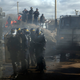 French police taking position at the Calais camp (AP Photo/Jerome Delay)